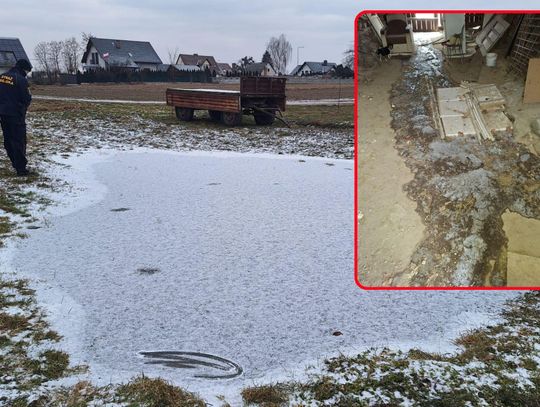 Straż Miejska w Niemodlinie zabezpiecza sprzęt po wykryciu zamarzniętych nielegalnych ścieków na ulicy w Grabinie